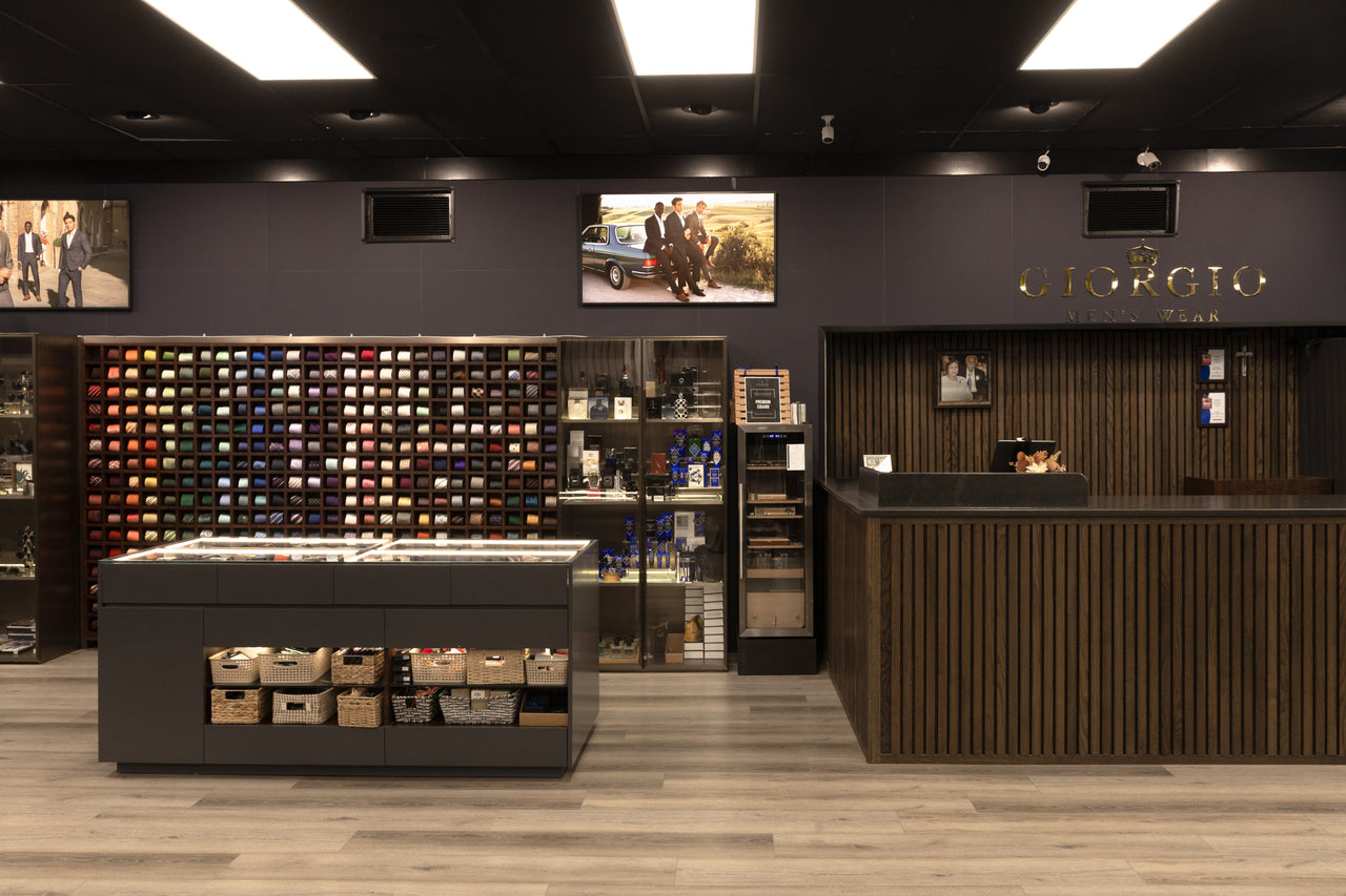 The Giorgio Men’s Wear service counter, wall logo and tie displays in Chattanooga