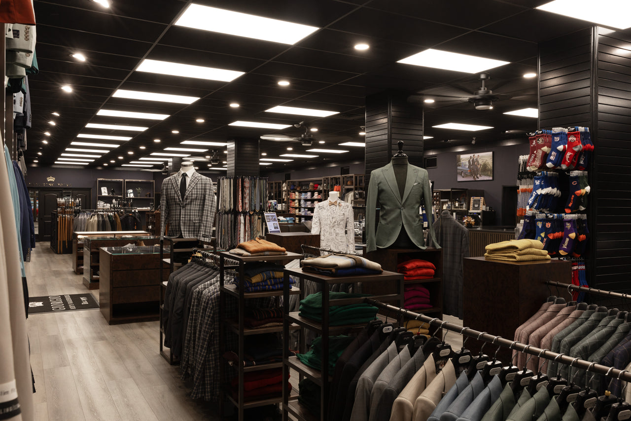 Inside Giorgio Men’s Wear, with suits, mannequins and accessories on display